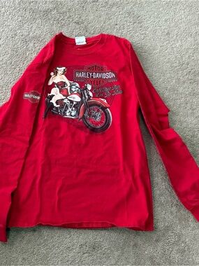 Vintage NWOT. Woman’s Harley-Davidson
Holiday Pin Up Girl Long Sleeve Red Tee